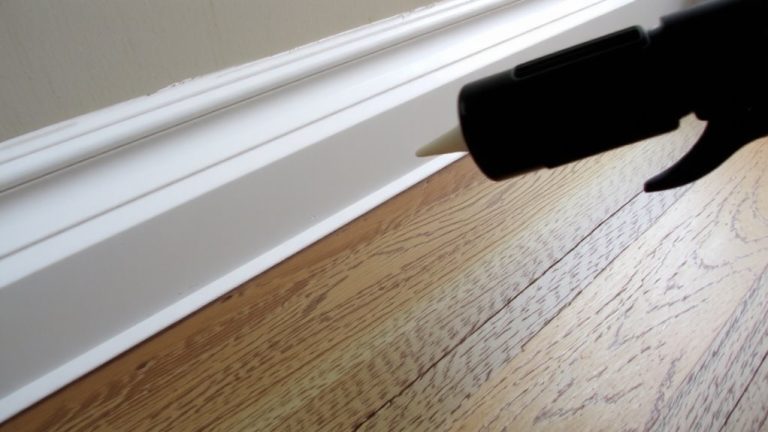 apply caulk evenly along baseboard