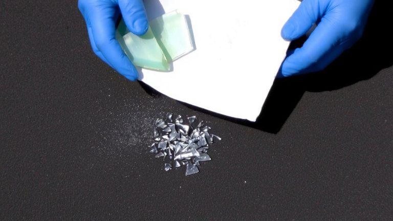 carefully sweep glass shards